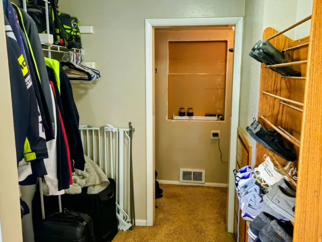 Walk in closet featuring carpet flooring