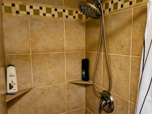 Bathroom view of shower / bath combo
