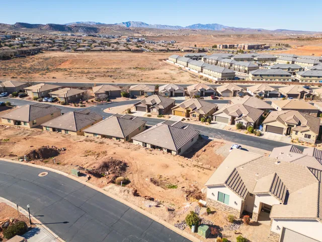 Aerial perspective of suburban area with a mountainous background