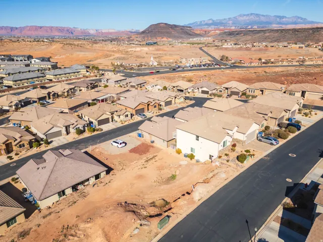 Aerial view of residential area featuring mountains