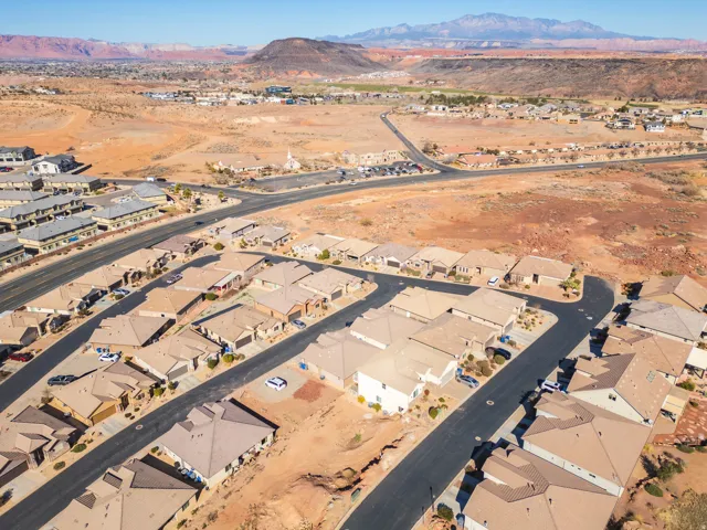 Aerial perspective of suburban area featuring a mountain backdrop