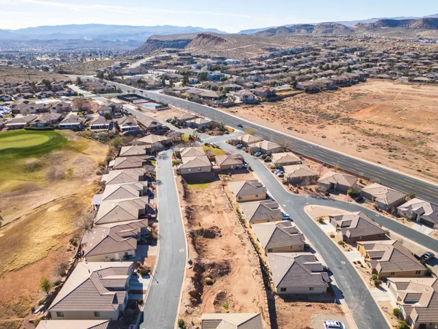 View of property location featuring nearby suburban area and a mountain backdrop