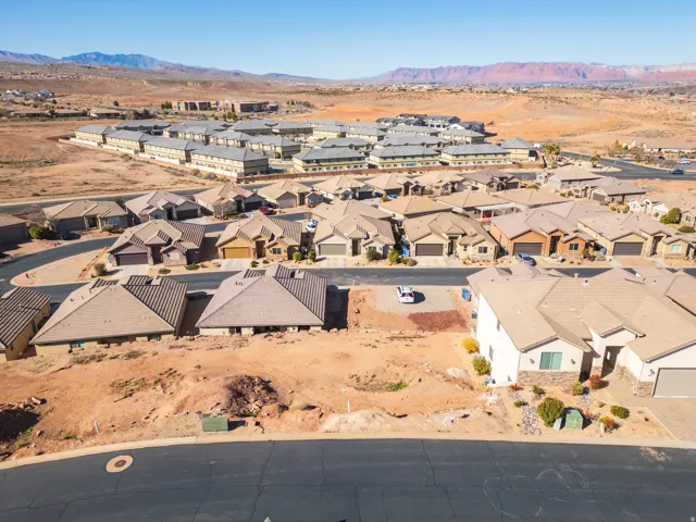 Aerial perspective of suburban area featuring a mountainous background