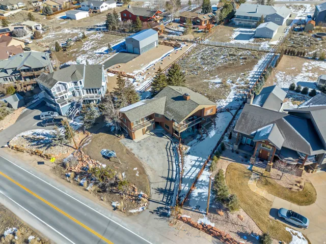 Snowy aerial view featuring a residential view