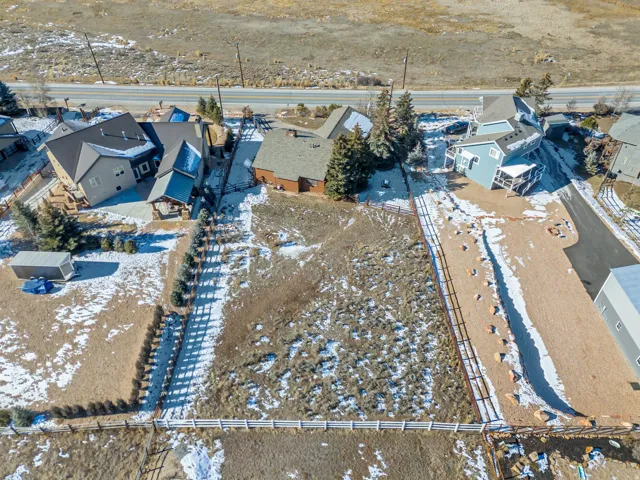 Snowy aerial view with a residential view