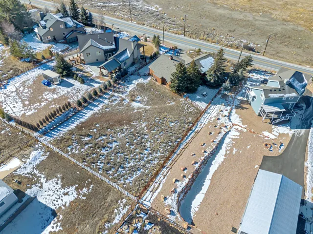 Snowy aerial view featuring a residential view