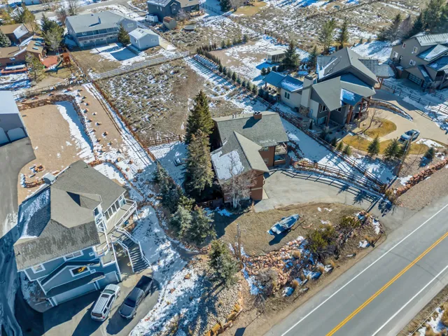 Snowy aerial view with a residential view