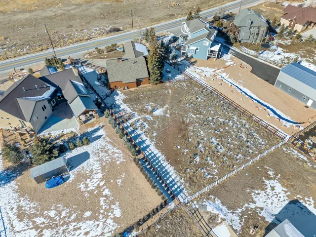 Snowy aerial view with a residential view