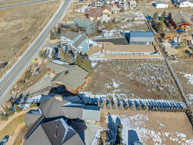 Snowy aerial view featuring a residential view