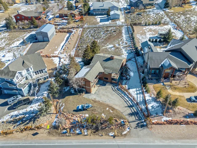 Snowy aerial view with a residential view