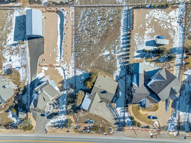 Snowy aerial view featuring a residential view