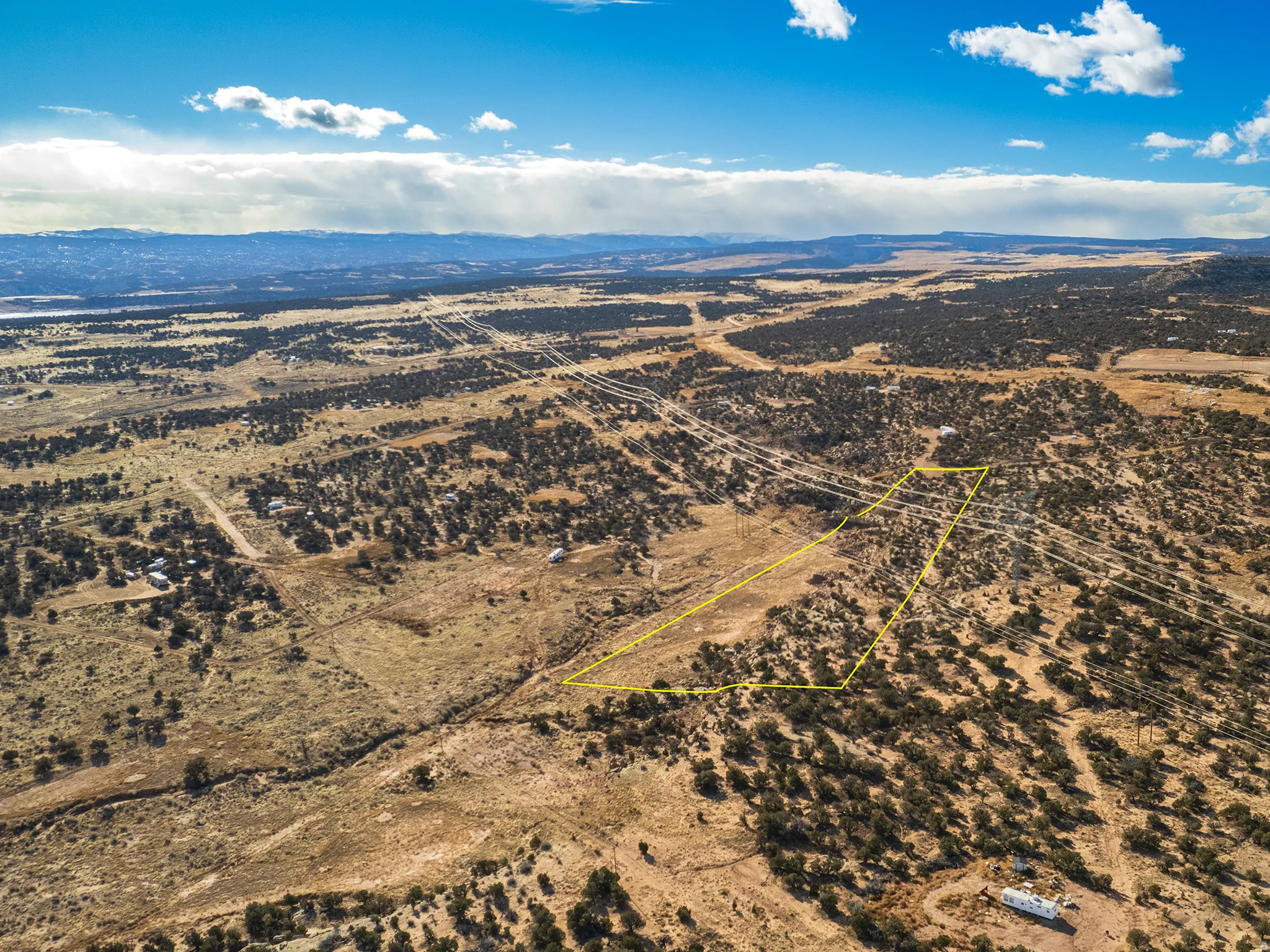Overview of rural landscape with a mountainous background and a desert landscape