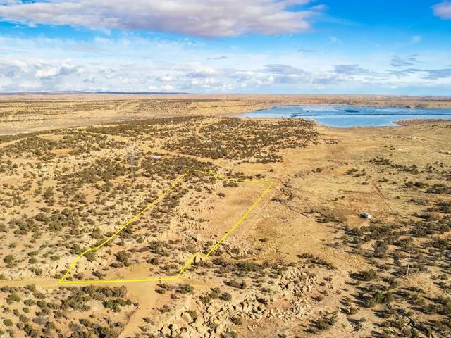 Overview of rural landscape featuring a desert landscape with a lake view.