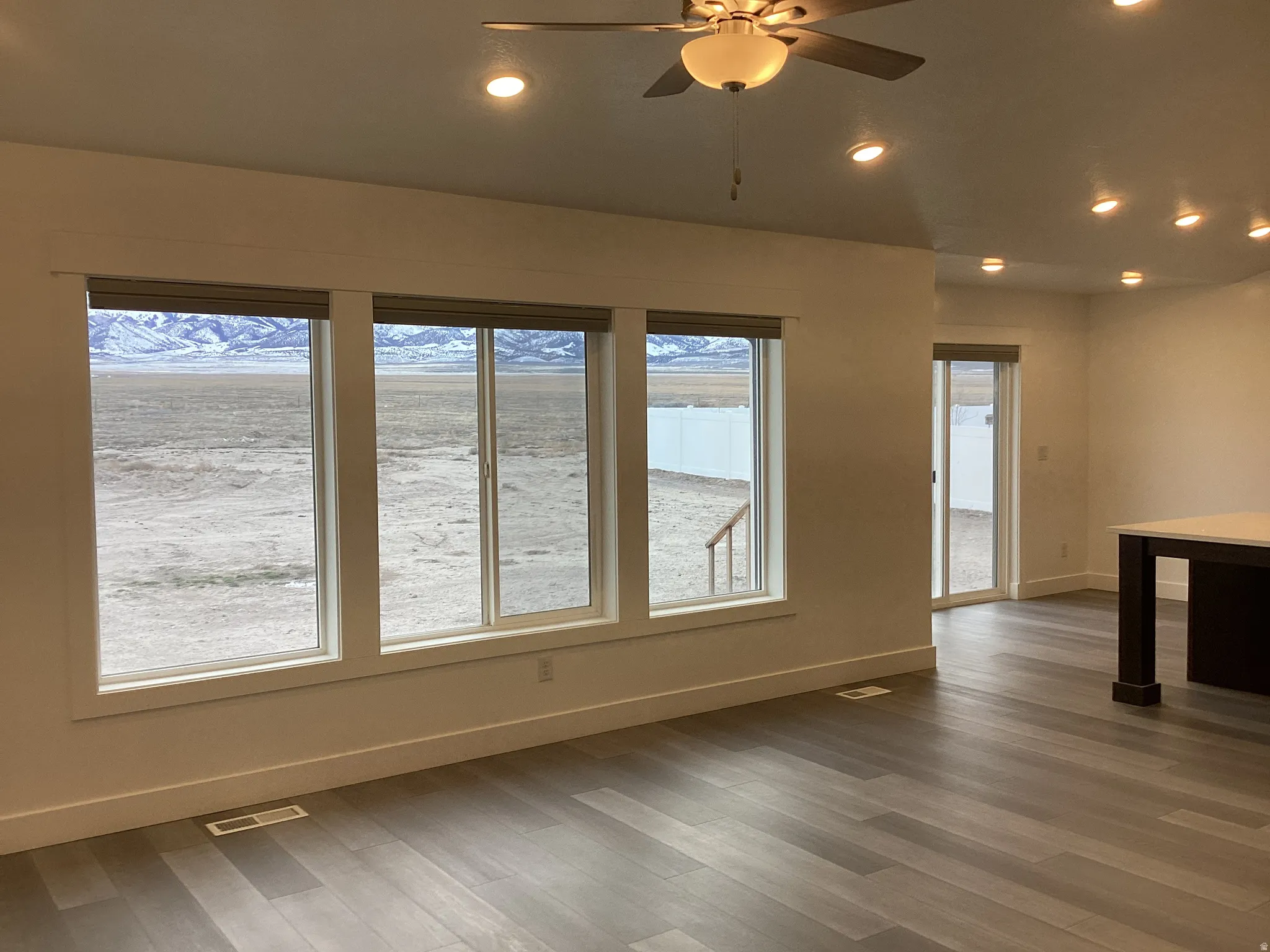 Empty room with recessed lighting, a ceiling fan, and wood finished floors