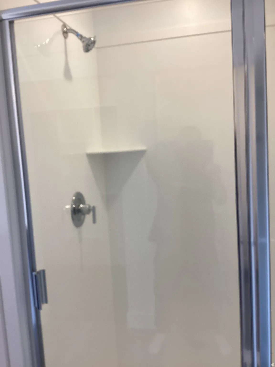 Full bath featuring a shower stall