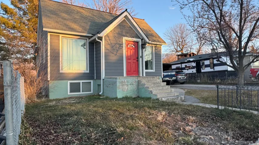 View of front of property with roof with shingles