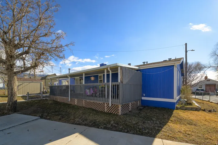 Rear view of property featuring a deck