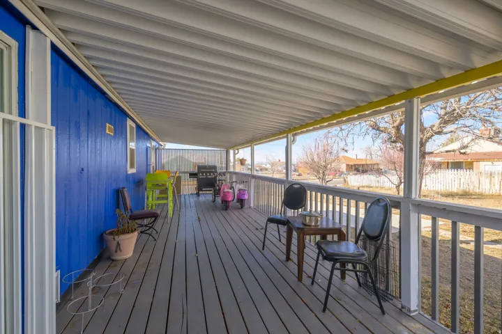 Wooden deck featuring grilling area