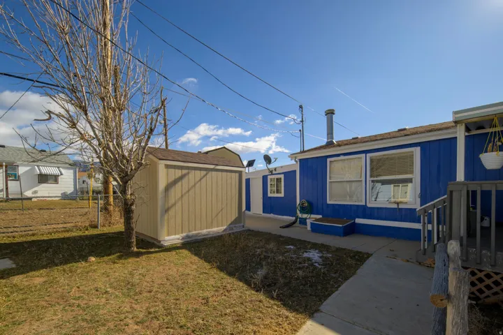 View of yard with a storage unit
