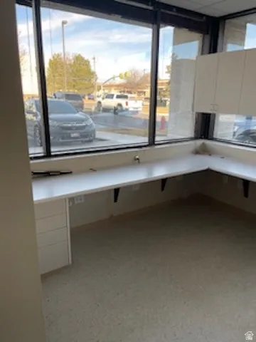 Unfurnished office with light flooring