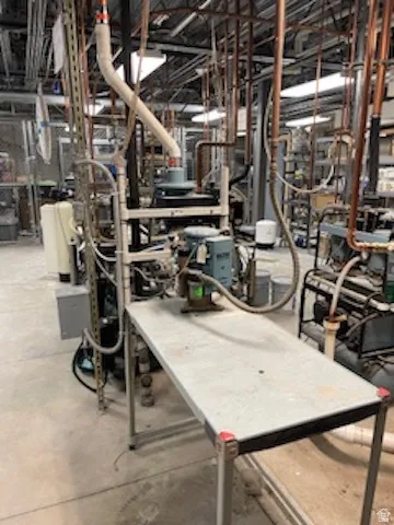 Miscellaneous room with unfinished concrete floors