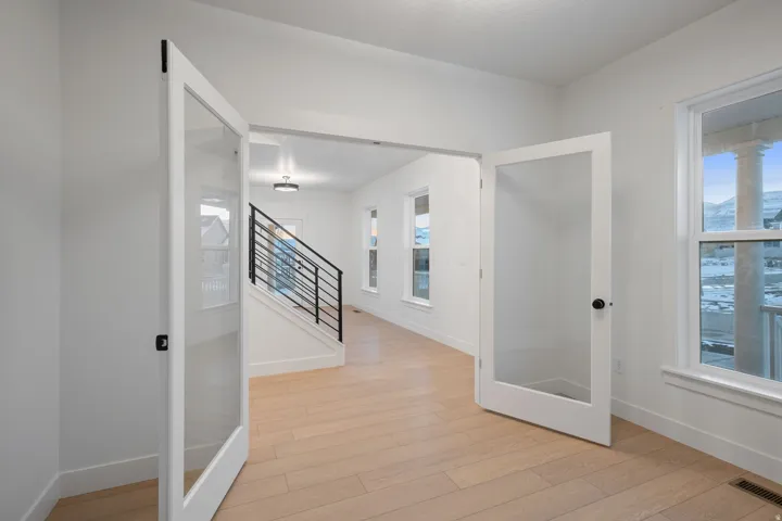 Hall featuring light wood-style floors and stairway