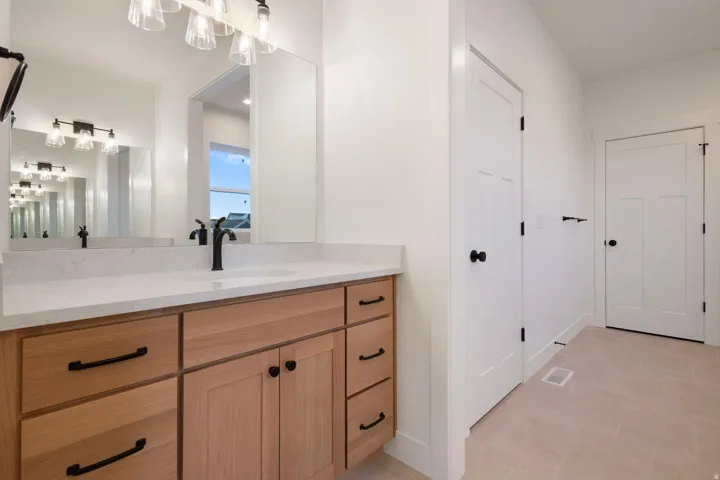 Bathroom with vanity and light tile patterned floors