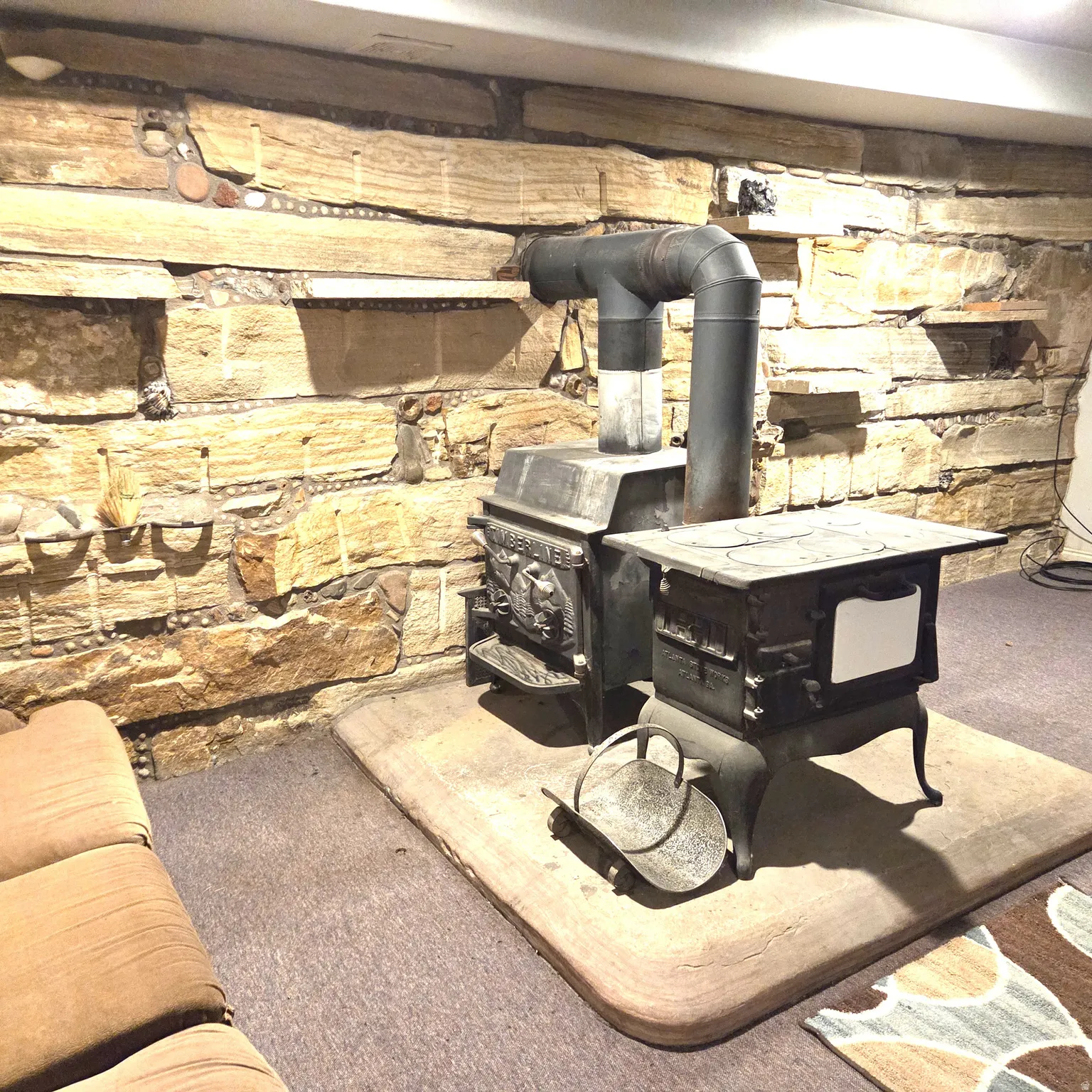 Detailed view of a wood stove and carpet flooring