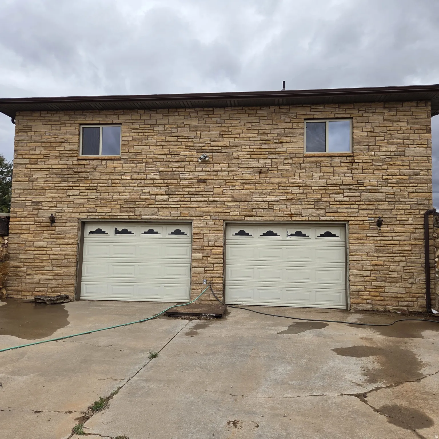 Garage featuring driveway