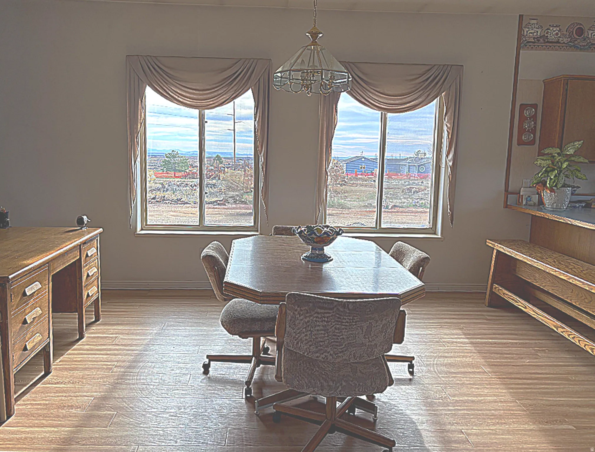 Casual dining room with breakfast bar at kitchen counter.