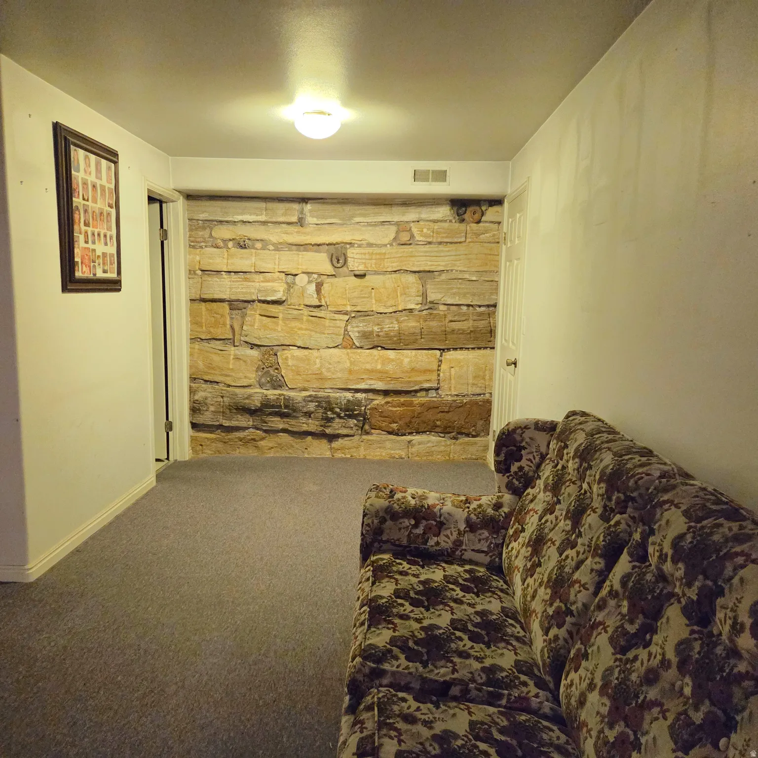 Sitting room with carpet and baseboards