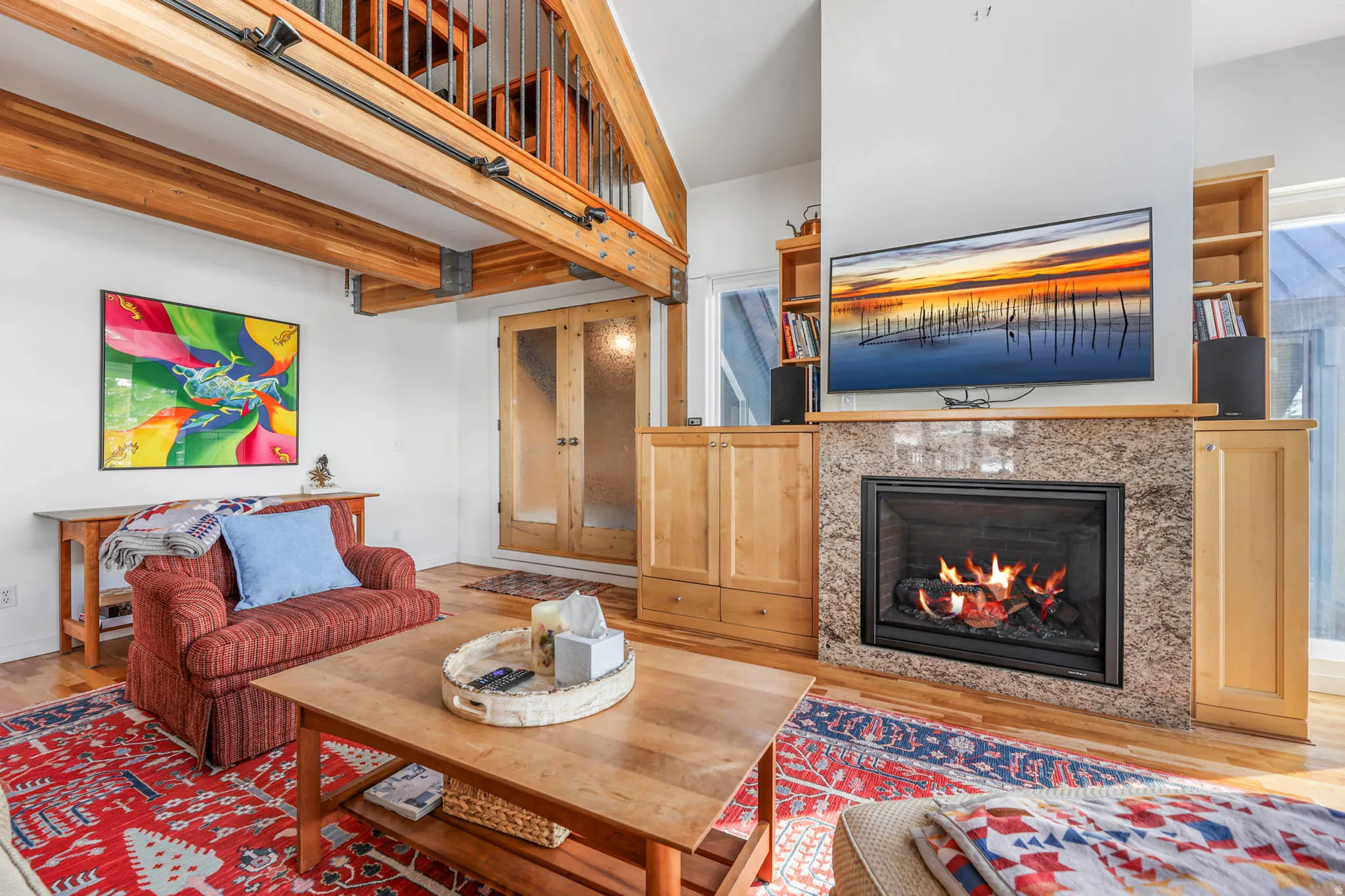 Living area featuring wood finished floors and a new fireplace insert