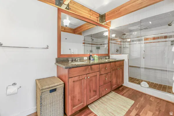 Ensuite bathroom with double vanity and steam shower