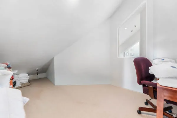 Office with slanted ceiling A few steps off the loft.