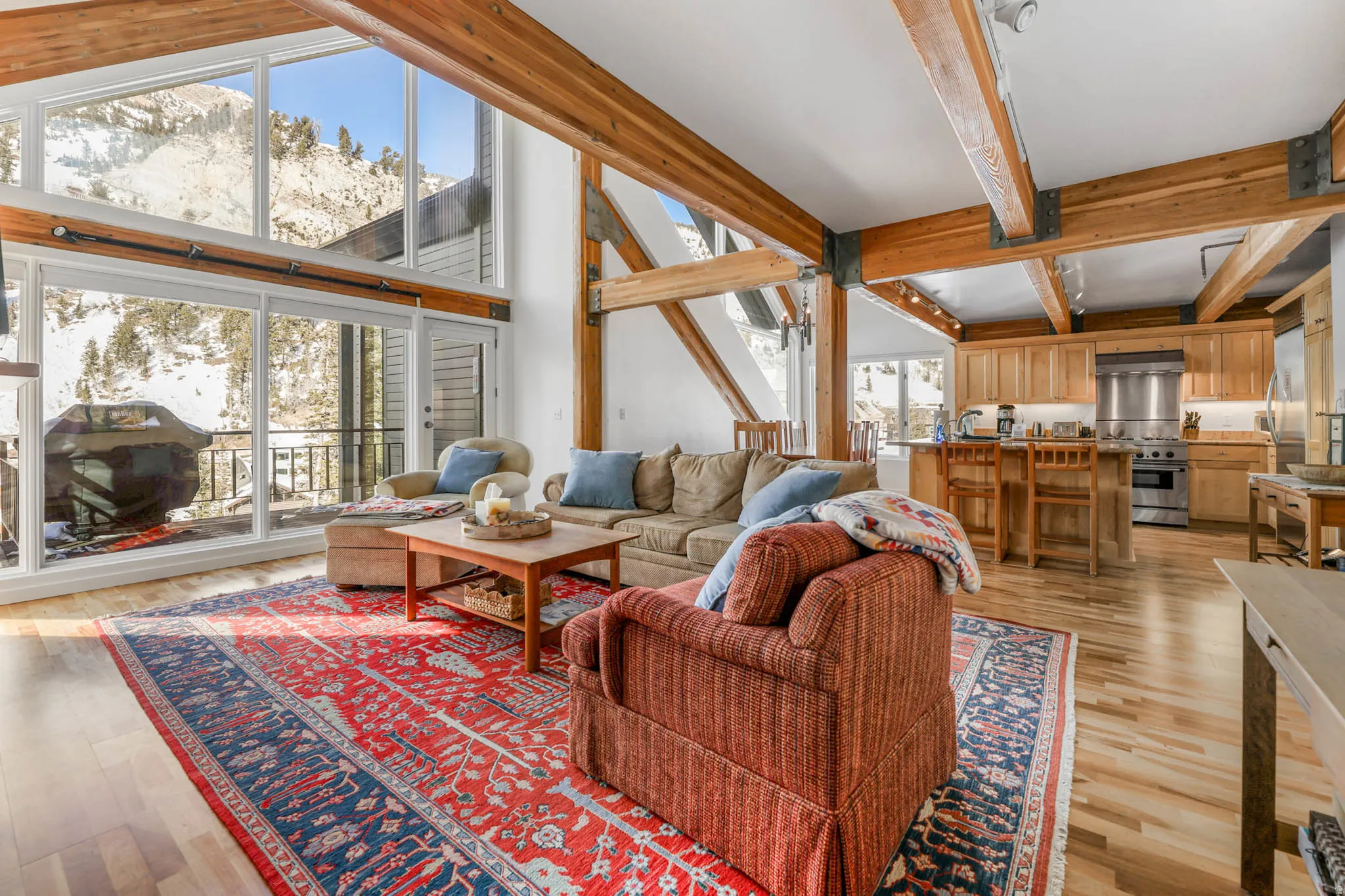 Living room featuring  a vaulted beam  ceiling, and a mountain view
