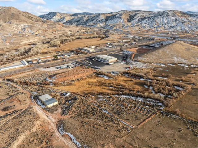 Aerial overview of property's location with a mountain backdrop