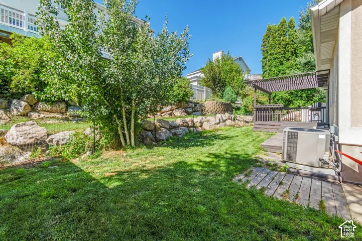 View of yard with a deck