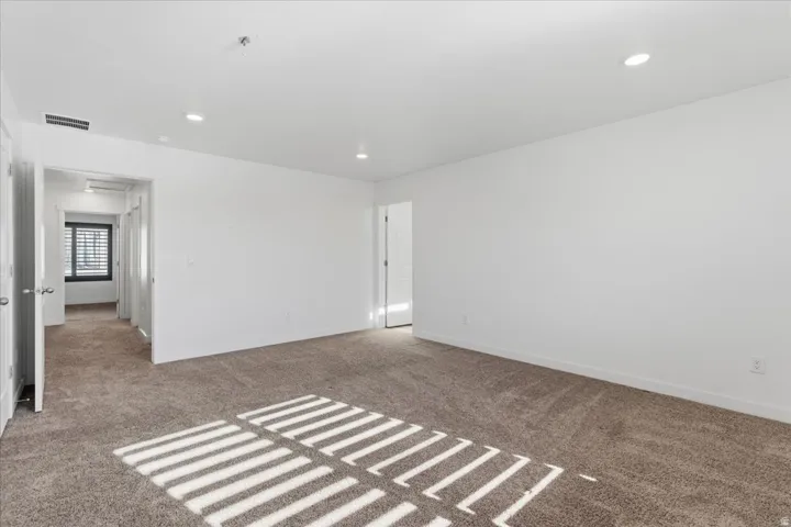 Bedroom with carpet flooring and recessed lighting