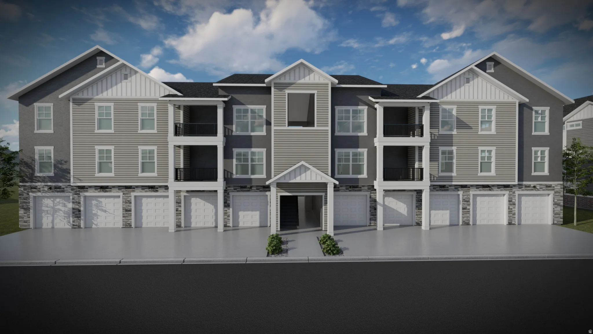 View of front of property featuring board and batten siding, stone siding, and a balcony