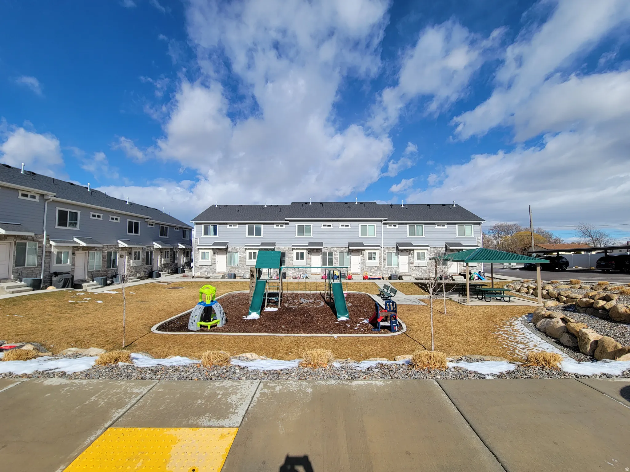 Park directly across from front door: featuring a playground with slides & picnic area. Great place for kids!