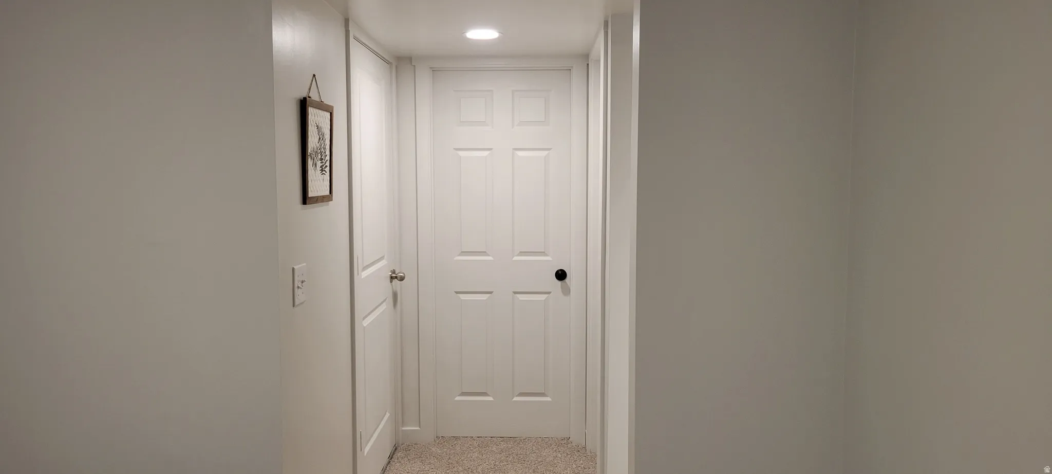Finished Hallway featuring recessed lighting and brand new light colored carpet