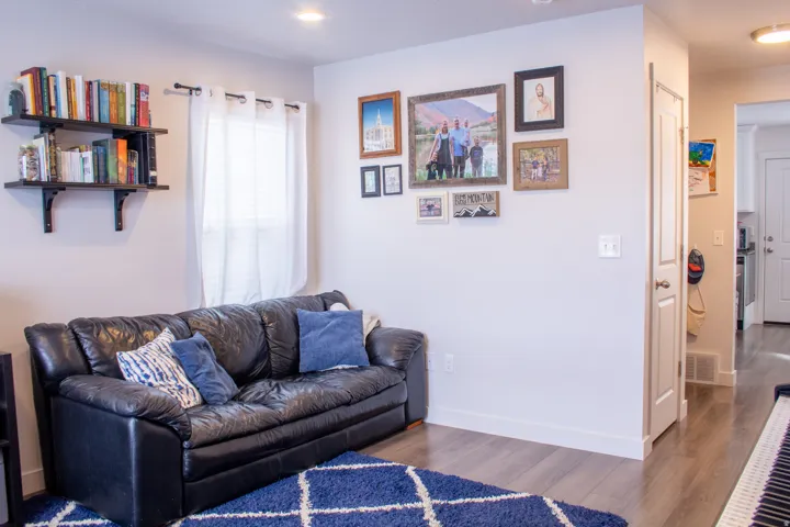 Living area featuring wood finished floors and recessed lighting