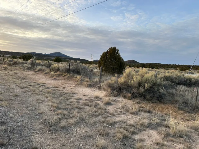 View of mountain backdrop with rural landscape