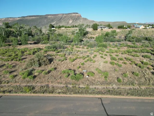 View of mountain backdrop with rural landscape