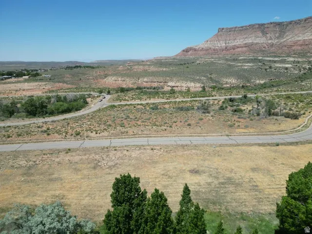 View of mountain backdrop with rural landscape