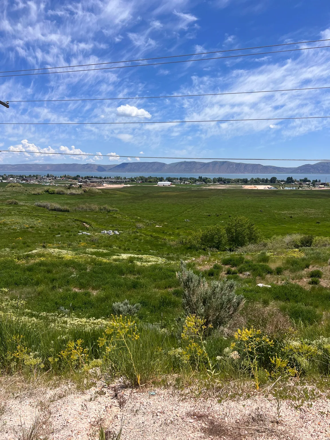 View of mountain backdrop featuring rural landscape