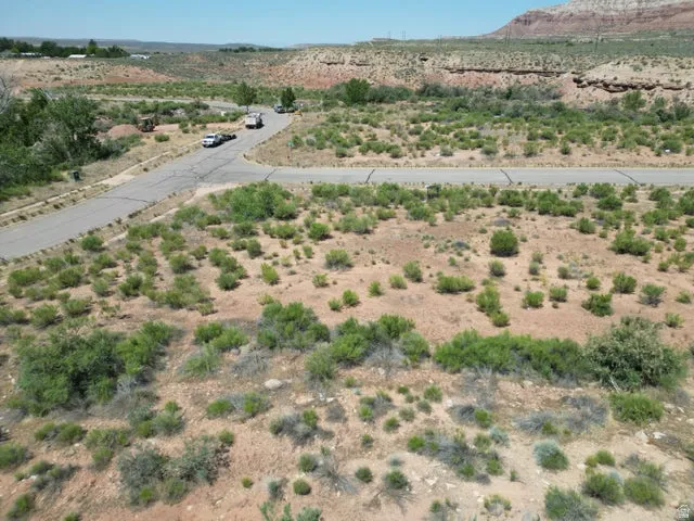 Aerial overview of property's location with rural landscape and mountains