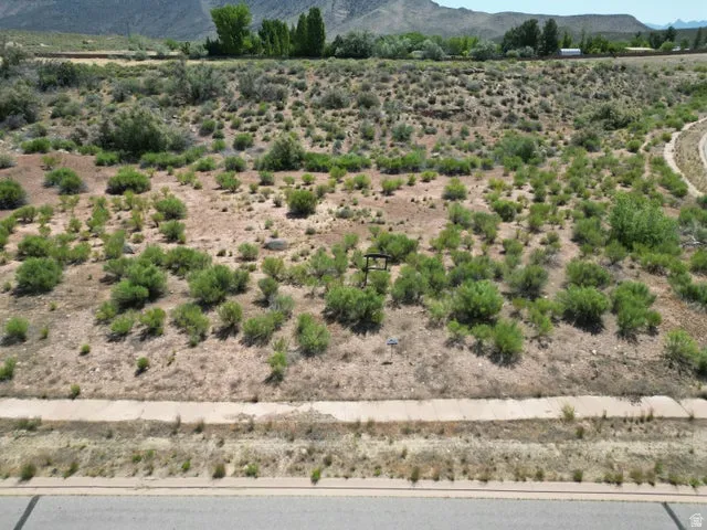 View of mountain backdrop with rural landscape and a desert landscape