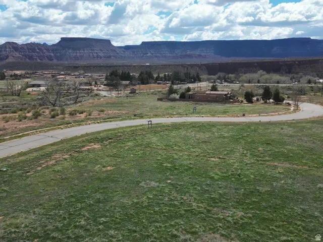 View of mountain backdrop with rural landscape