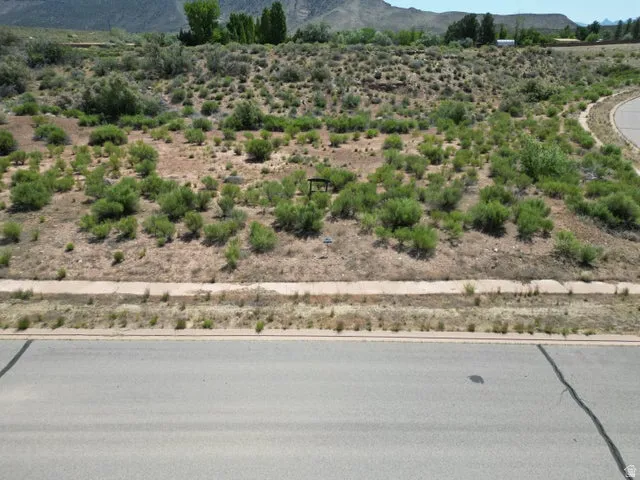 View of mountain backdrop featuring a desert landscape and rural landscape